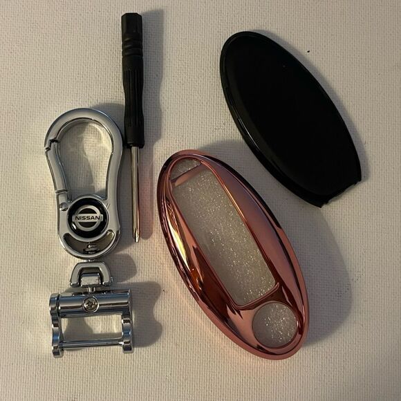 Nissan logo Key Fob Keychain in Silver and Fob Case Cover in Pink NWT - Picture 1 of 7